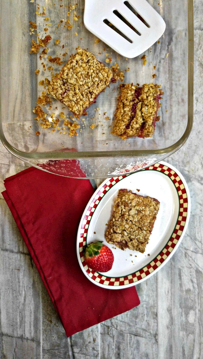 Serving dish and strawberry oatmeal bars on a plate - Gluten free and vegan adjustments!