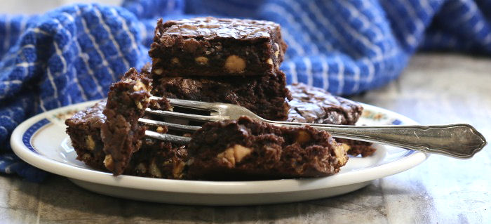 Taking a bite of this rich chocolate brownie recipe