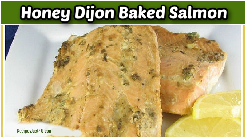 Honey Dijon baked salmon on a white plate with mustard sauce.