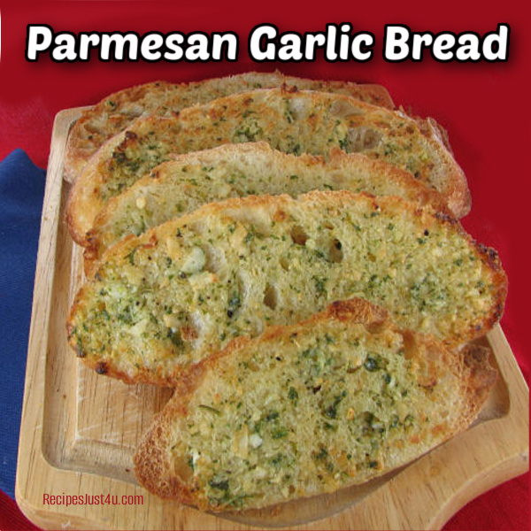 Sliced Parmesan garlic bread on a cutting board.