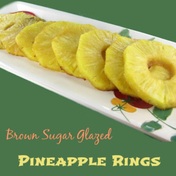 Baked pineapple rings one flowered white plate.