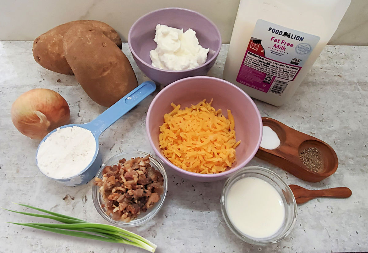 Potatoes, onion, sour cream, heavy cream, milk, cheese, flour, bacon, spring onions and salt and pepper.