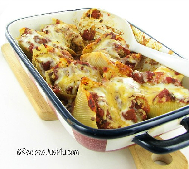 Easy taco stuffed shells covered in cheese in a baking dish.