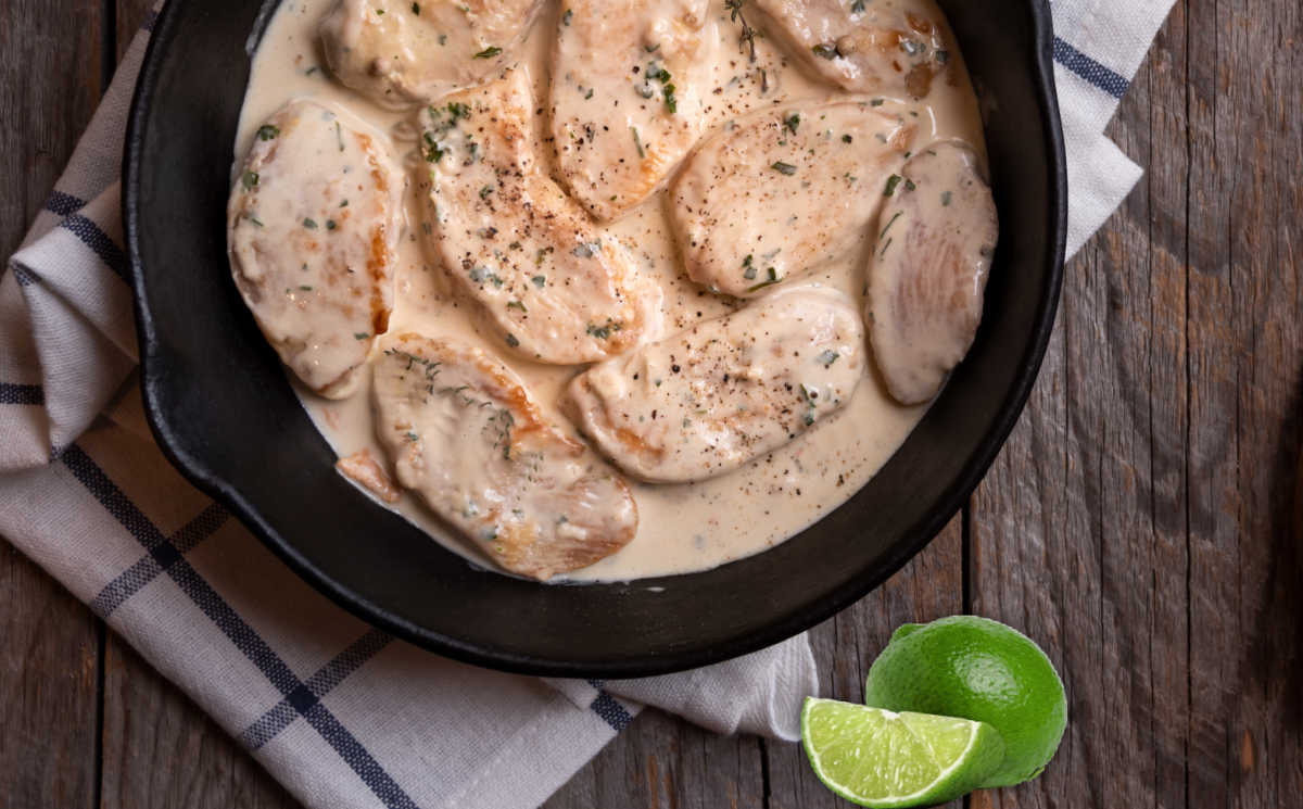 Cooking chicken tenders in a lime cream sauce.