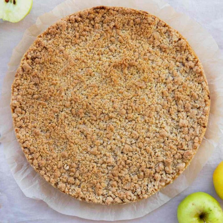 Crumble crust and apples on parchment paper.