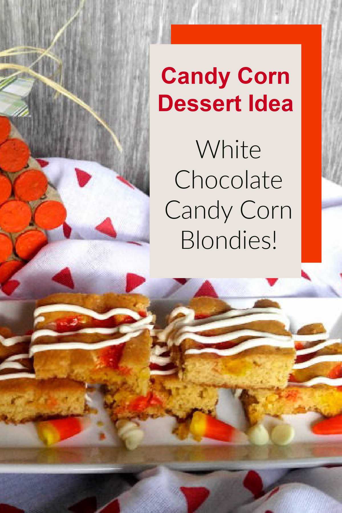 Plate of candy corn blondies near a red and white towel and cork pumpkin with text overlay reading Candy Corn Dessert Idea - White Chocolate Candy Corn Blondies.