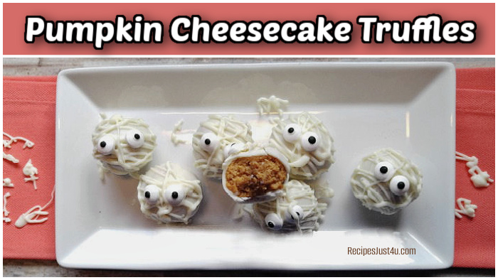 Mummy pumpkin cheesecake truffles on a white plate with a pink napkin.