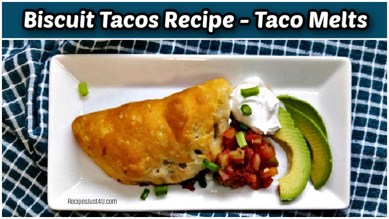 Biscruit tacos on a white plate with beans and avocado.