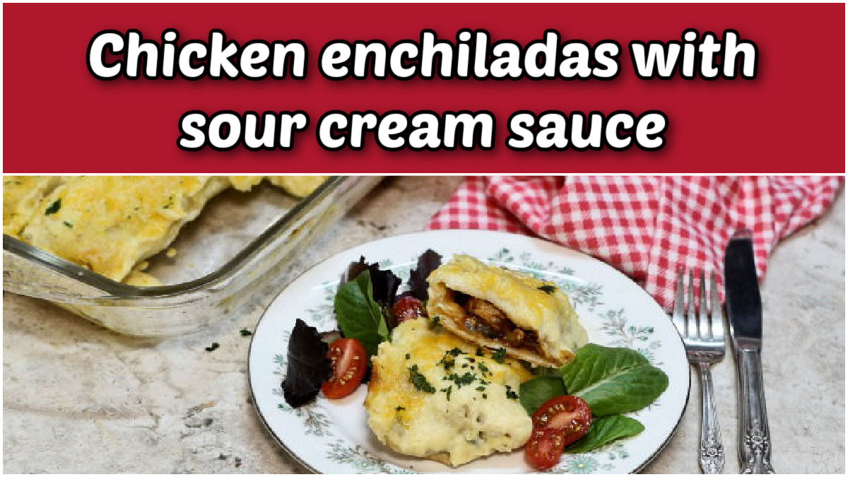 Chicken enchiladas with sour cream sauce next to a serving dish with cutlery.