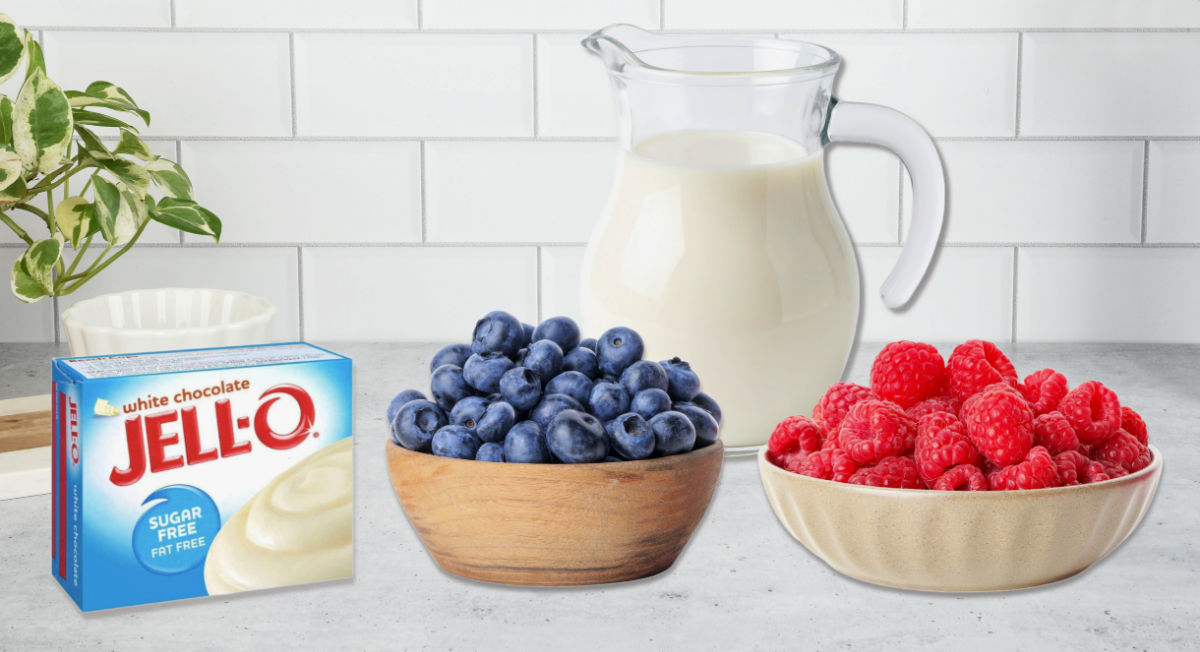 Ingredients for pudding pops recipe - raspberries, blueberries, pudding mix and milk.