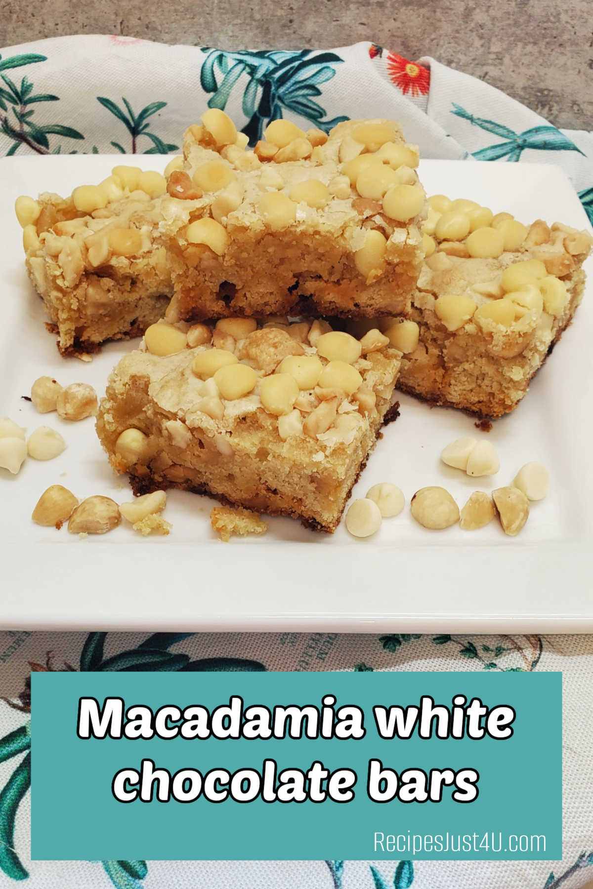 A flowered towel with a white plate holding a stack of macadamia nut bars. Teal text box reads Macadamia white chocolate bars.