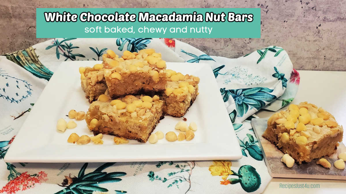A dessert bar stacked on a white plate over a colorful napkin. Teal text box reads white chocolate macadamia nut bar. Soft baked, chewy and nutty.