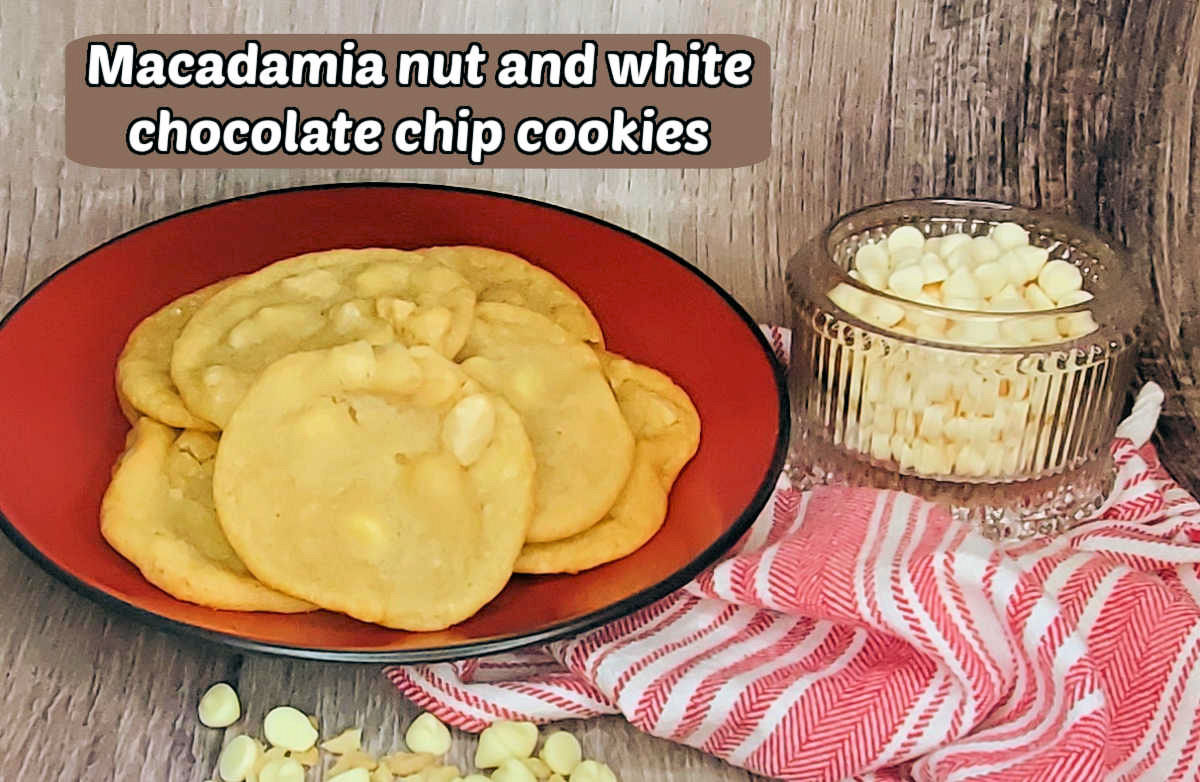 A red plate with cookies on it sitting next to a striped red towel and bowl of white chocolate chips. Brown text box reads Macadamia nut and white chocolate chip cookies.