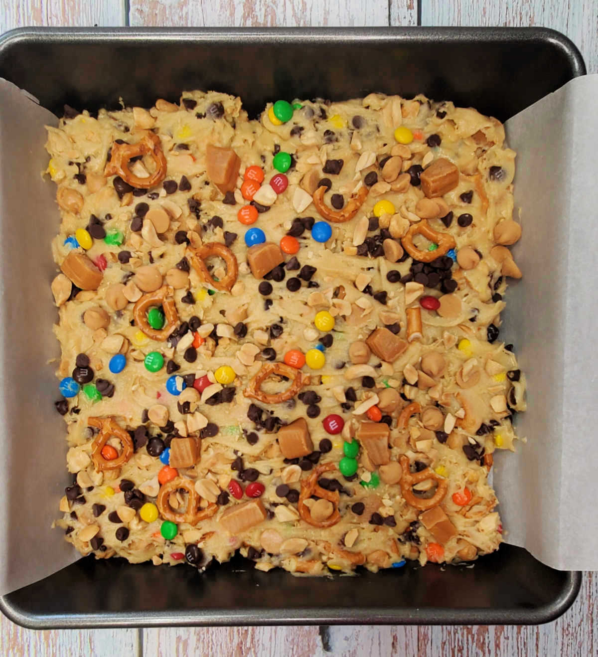 Kitchen sink dessert bar recipe, in a pan ready to bake.