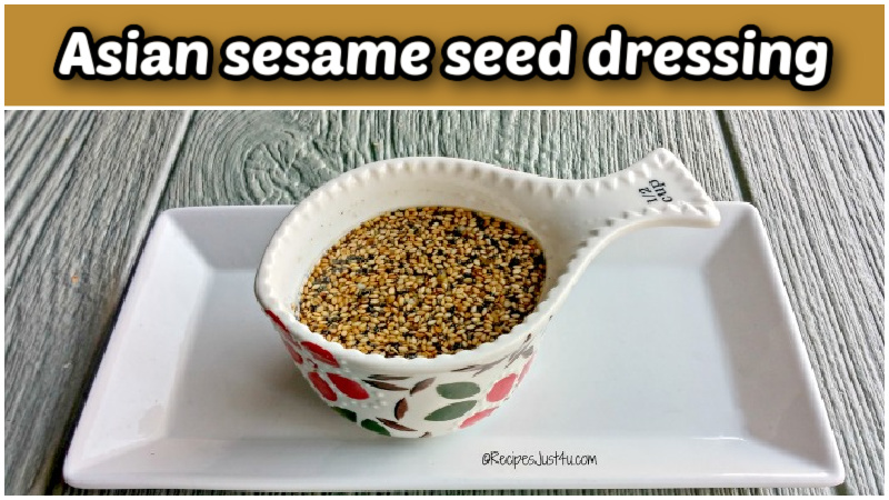 Asian sesame seed dressing in a small cup on a white tray.