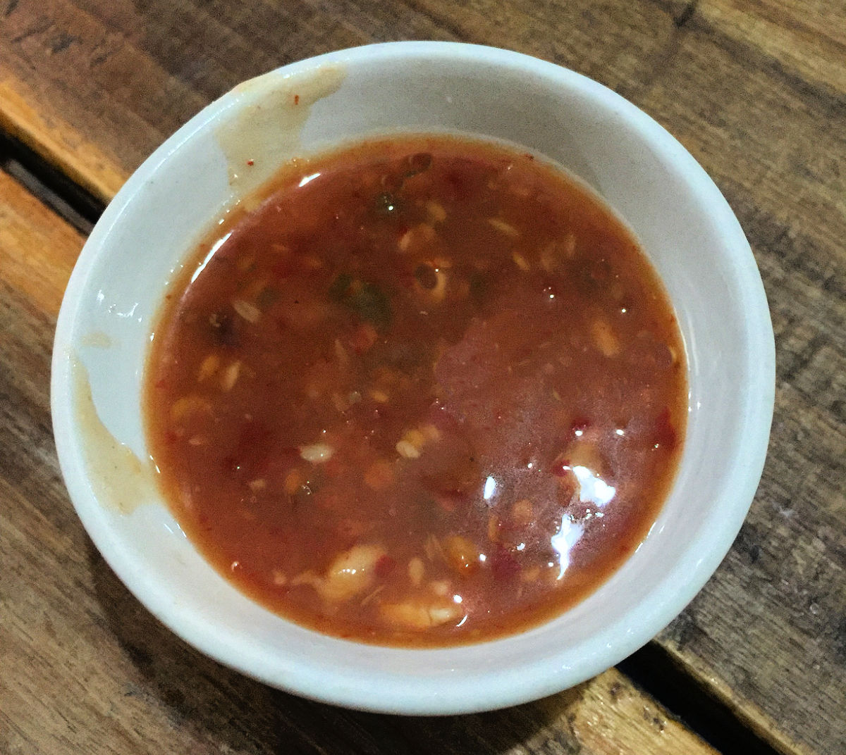 Sweet and savory sticky Asian sauce in a white bowl.