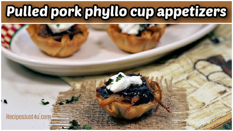 Pulled pork phyllo cup appetizers on a red and white plate.