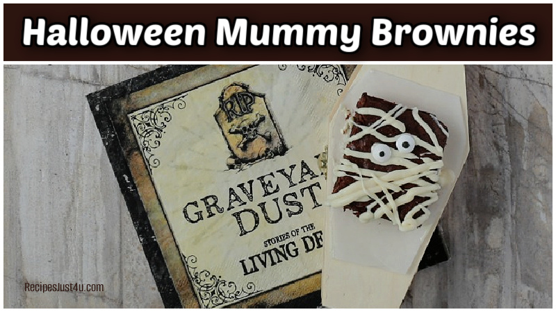 Halloween mummy brownies dessert on a spooky halloween and small wooden coffin.