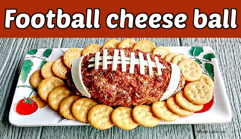 A cheese dip shaped and decorated like a football. Brown text reads Football cheese ball.