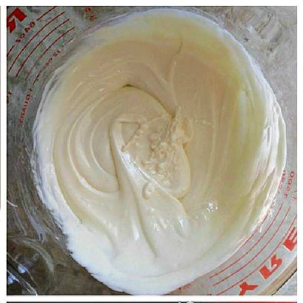 Melted white chocolate in a Pyrex bowl.