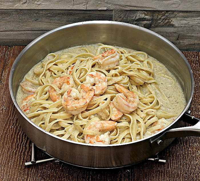 Making skinny shrimp Alfredo in a sauce pan.