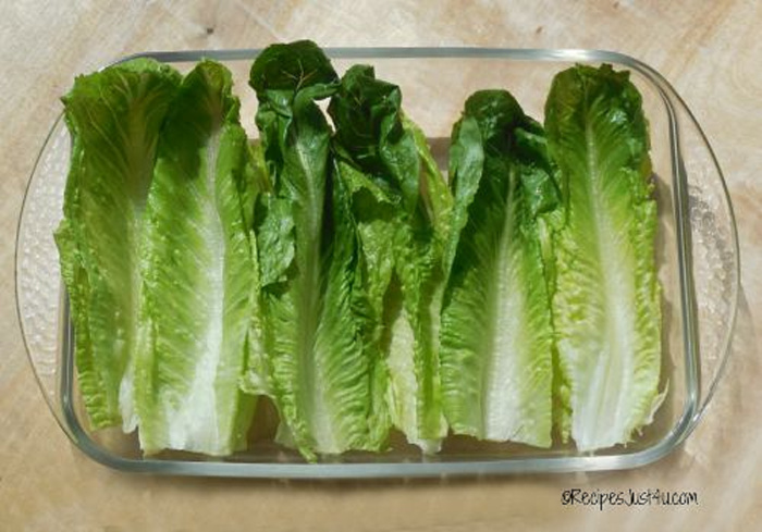 Romaine lettuce in a glass baking dish to make healthy taco lettuce wraps.